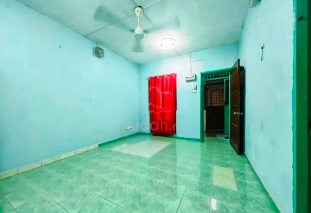 Room features: light green painted walls, white ceiling, green tiled flooring, ceiling fan, single light fixture, red curtain, wooden door, window with grille, air conditioning unit.